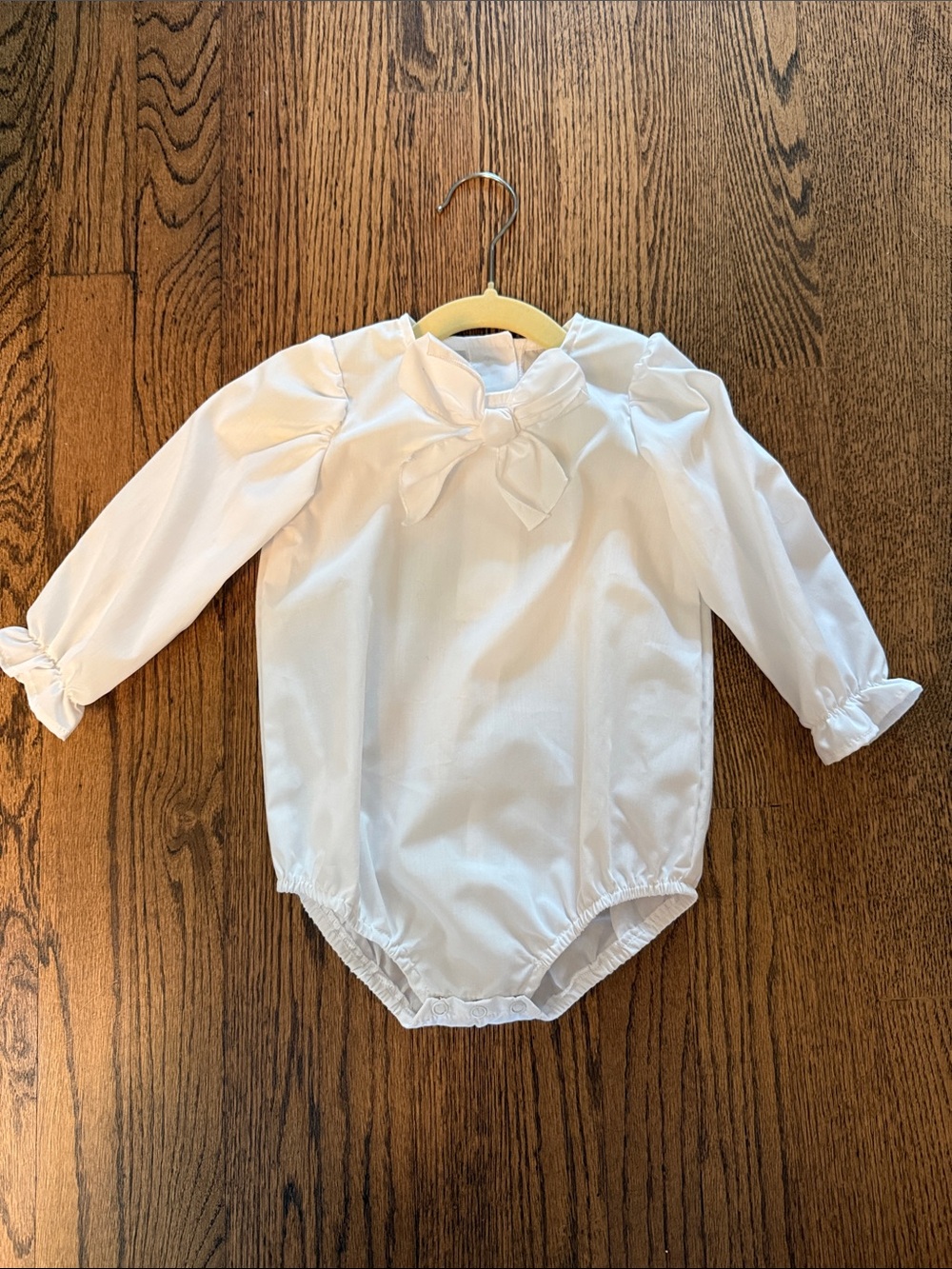 The Beaufort Bonnet Company White Long-Sleeve Bow-Front Baby One-Piece